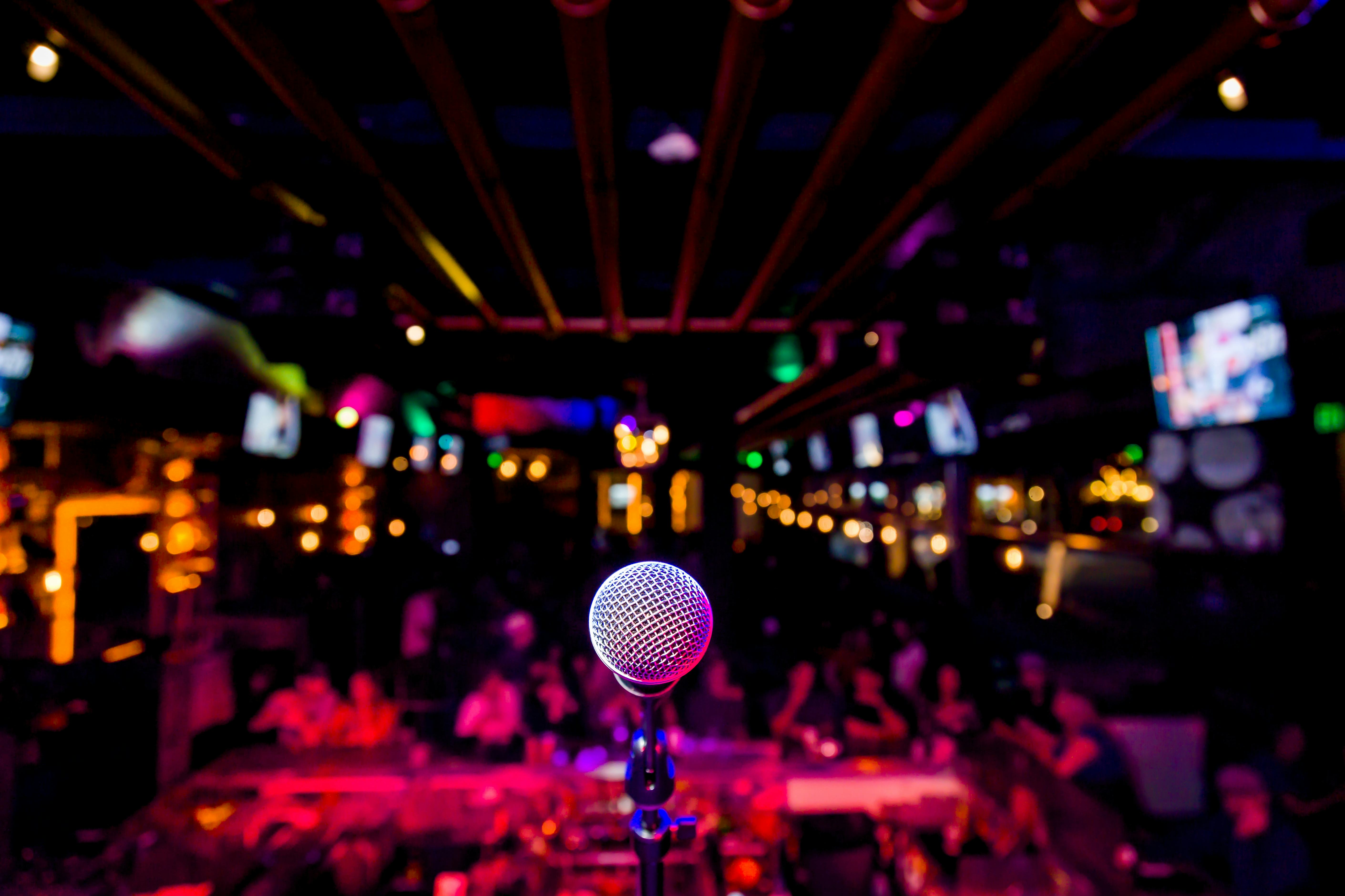 Comedy Microphone on Stage of Comedy Music Show in Club with Lights and Colors