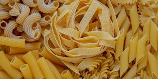 layout of Italian raw pasta, top view, different types and shapes of pasta, durum wheat noodles, clo...