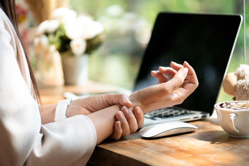 Stretching your wrists throughout the day can help relieve carpal tunnel pain.