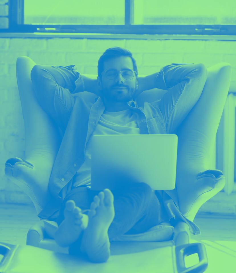 Front view peaceful young man in eyewear crossed hands behind head, fallen asleep on cozy armchair w...