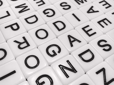 An array of lettered tiles in black and white