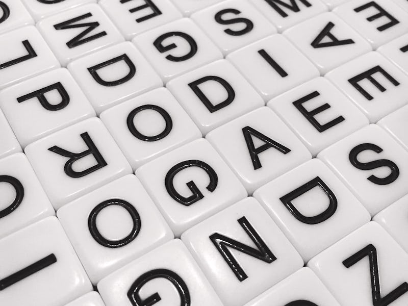 An array of lettered tiles in black and white