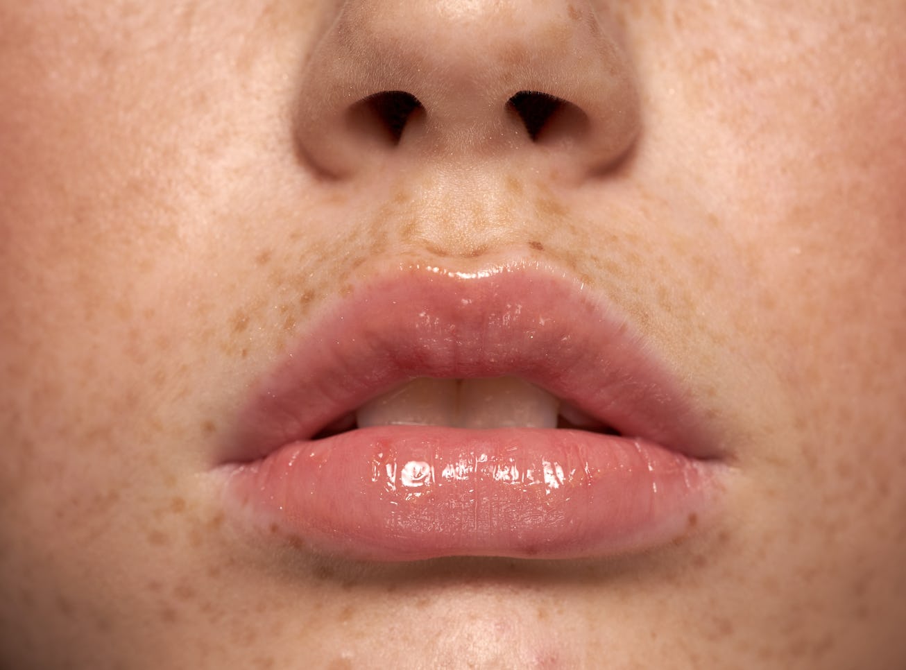 Amazing Lips young woman with Freckles Perfect Skin Closeup perfect natural lip makeup. Beautiful pl...