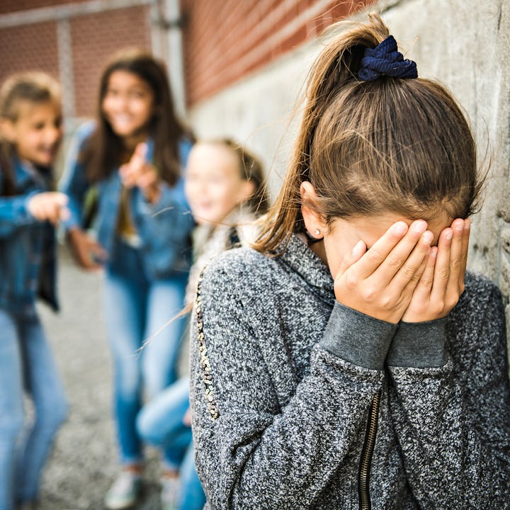 A girl cries after getting bullied -- a new study suggests that children with ADHD are nearly twice ...