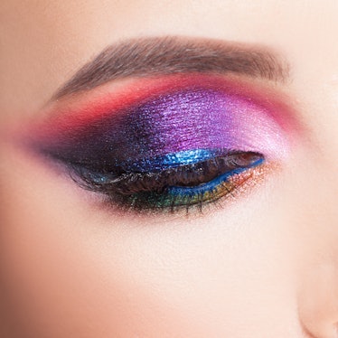 A cut crease eyeshadow look with bright, shimmering shades.