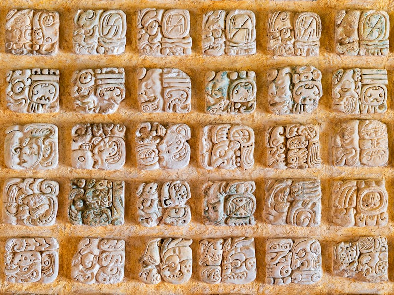 Square photograph of the Mayan alphabet. These hieroglyphs are found in the archaeological sites in ...