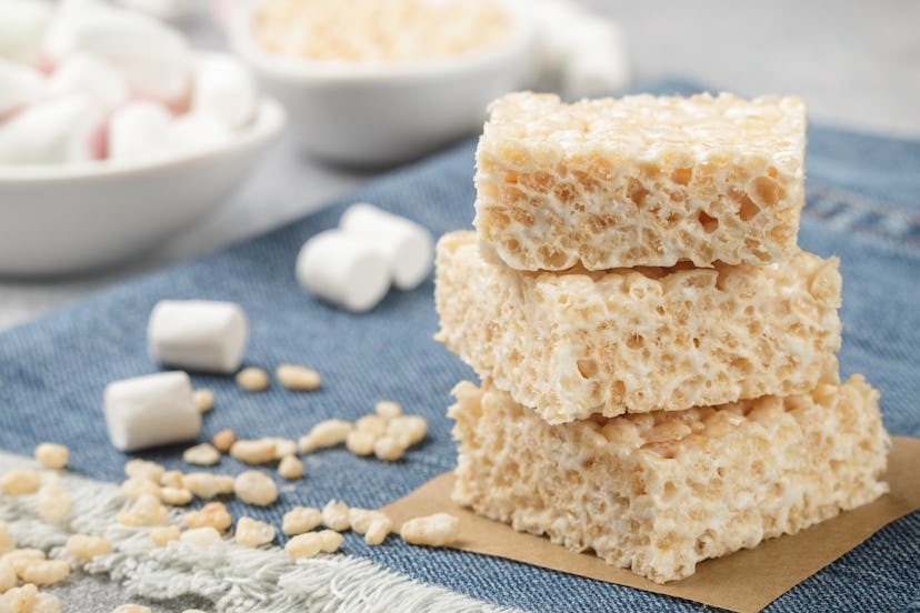 Homemade bars of Marshmallow and crispy rice and ingredients on the table. American dessert. Selecti...