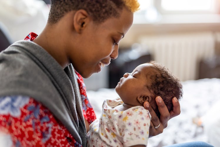 Shot of a mother spending time with her newborn baby