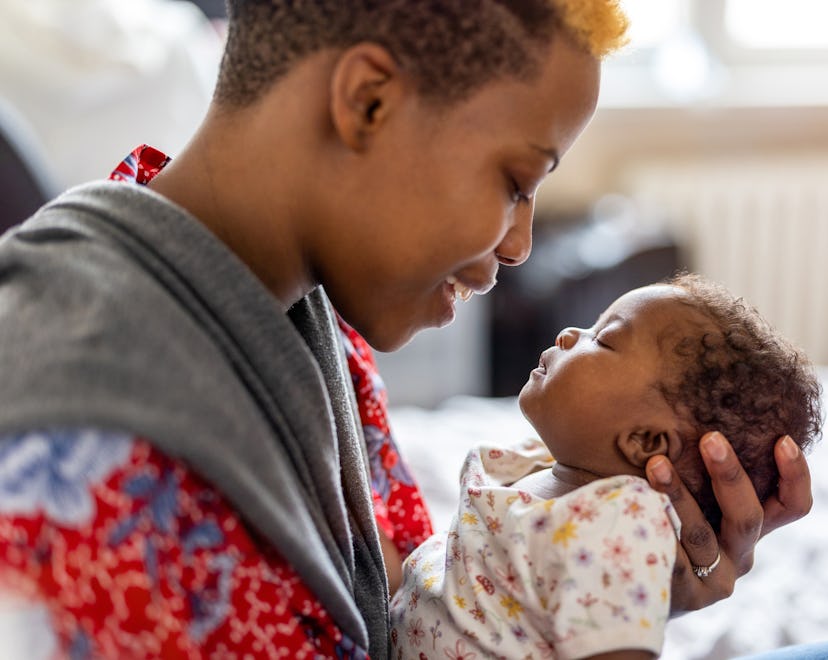 Shot of a mother spending time with her newborn baby