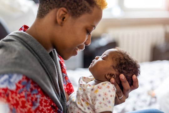 Shot of a mother spending time with her newborn baby
