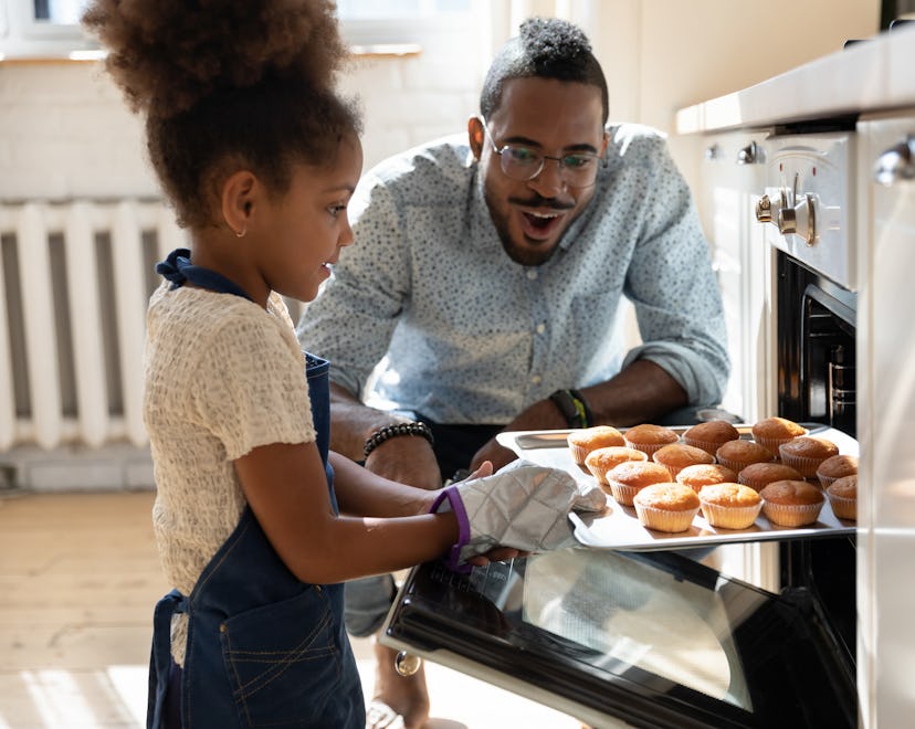 kid and dad cooking together in roundup of quotes about being a dad