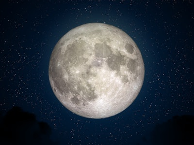 Full Moon in space with dark cloud in night sky. (Elements of this image furnished by NASA.)