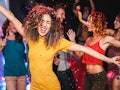 Young friends dancing at home private party - Happy people having fun listening music and drinking c...