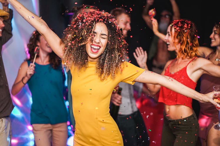 Young friends dancing at home private party - Happy people having fun listening music and drinking c...