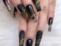 Scorpio Season Manicure: Black coffin nails with abstract art design gold color polish.