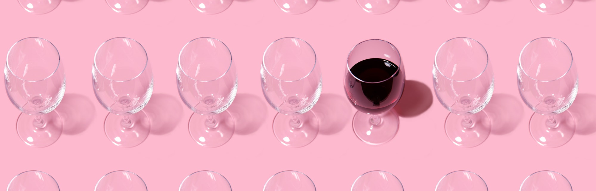 Glass pattern. Repeating empty wine glass on pink background.One glass filled with wine. Abstract ba...
