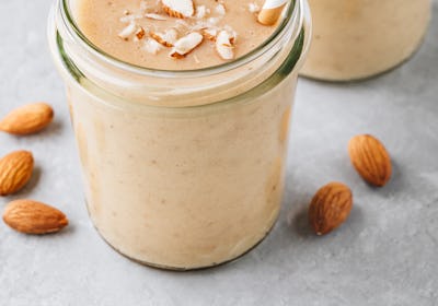 Banana almond smoothie with cinnamon and oat flakes and coconut milk 