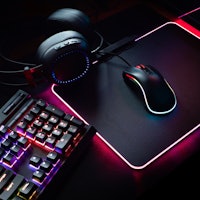 gamer workspace concept, top view a gaming gear, mouse, keyboard with RGB Color, joystick, headset, ...