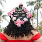For grad cap inspo, a woman wears a homemade graduation cap that's matching with her best friend.