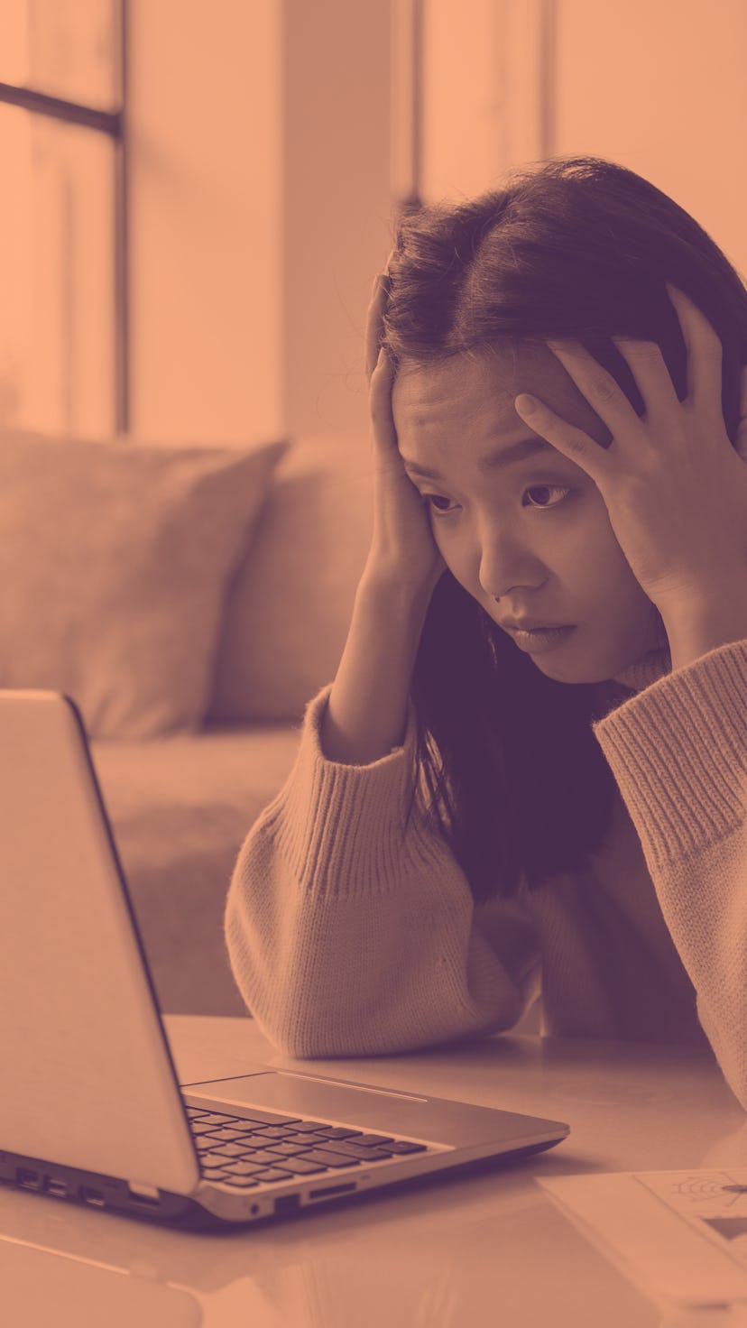 Tired, exhausted Asian woman with a laptop, problems with the project, feeling depressed, laziness i...