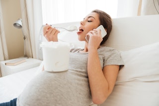 A pregnant woman eating ice cream. This week, a husband didn't understand just how bad pregnancy cra...