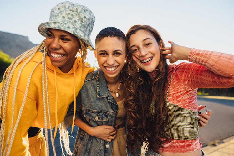Female friends thinks of a girls gang name for their group chat convos.