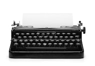 Old vintage typewriter and a blank sheet of paper inserted. Isolated on white background with clippi...