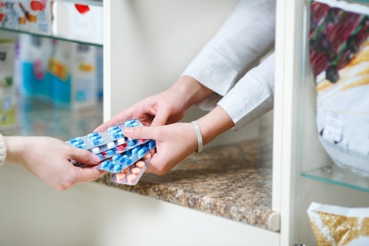 pharmacist giving patient birth control, which may be at risk now that abortion is banned