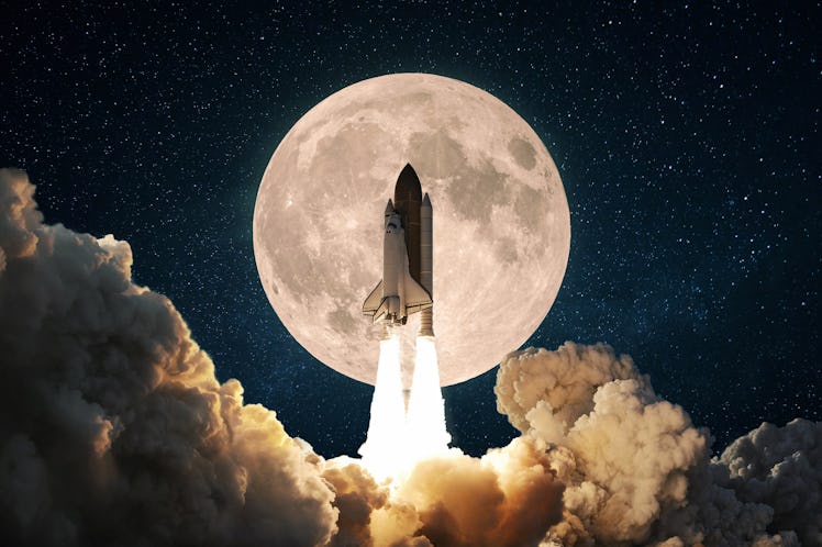 New space rocket with smoke and clouds takes off into the sky with full moon. Shuttle spaceship lift...