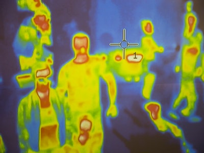 Thermal scanner / camera detecting infected people with Covid-19. Group of people under thermal imag...