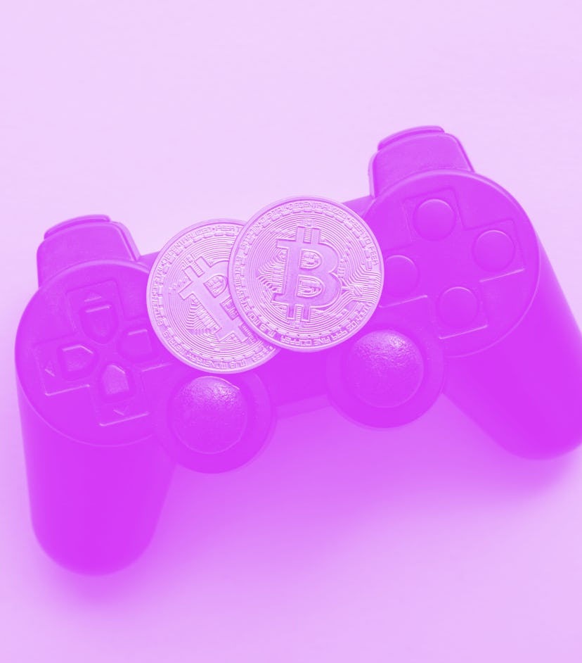 Crypto gaming concept. Video game controller with a bitcoin cryptocurrency coin