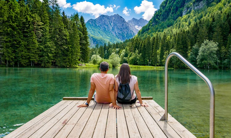 View of a couple sitting and enjoying baecation ideas during the summer.