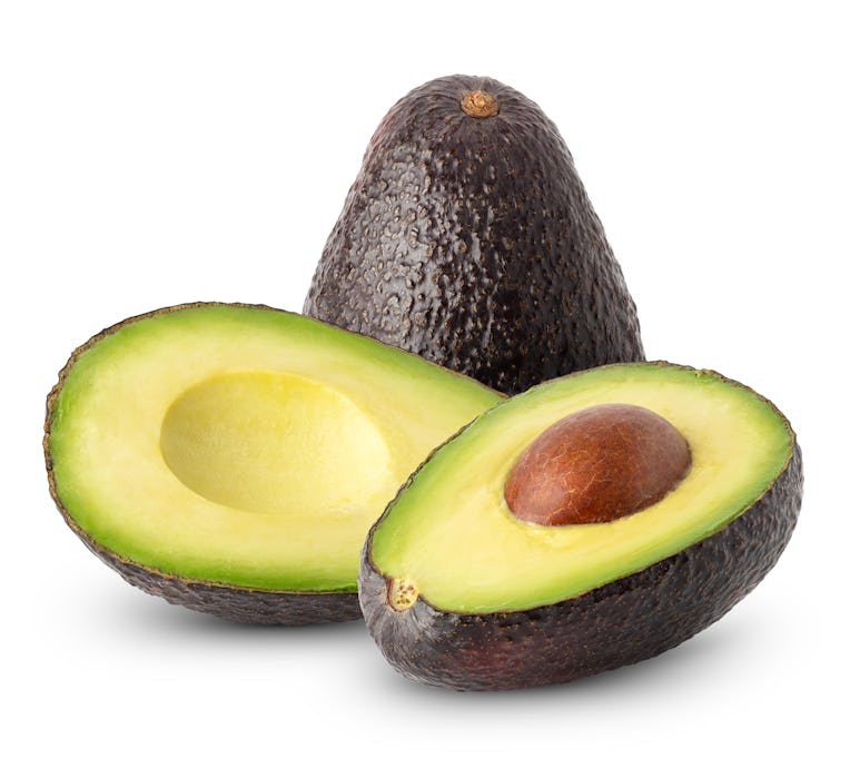 Isolated avocado. Whole avocado fruit and cut with half isolated on white background