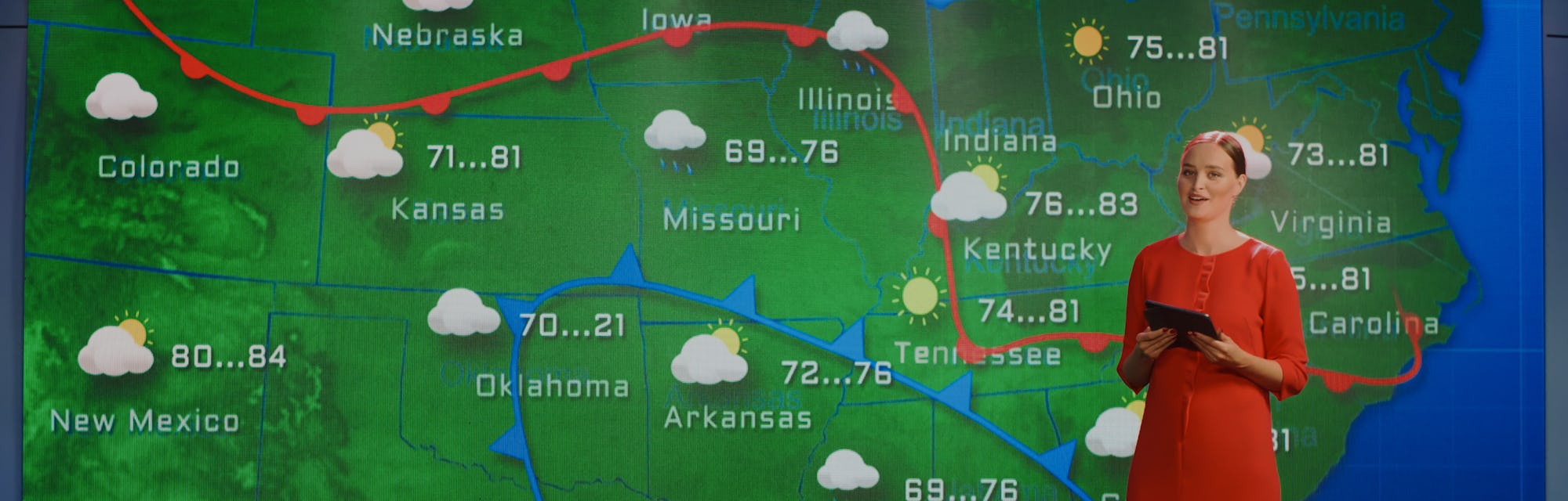 Live Weather News Studio with Professional Female On-Camera Meteorologist Standing Beside Screen and...