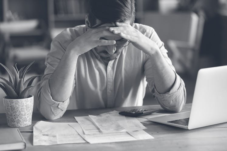 Sad depressed man checking bills, anxiety about debt or bankruptcy, financial problem, bank debt or ...