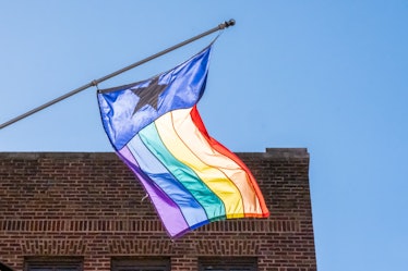 A sunlit rainbow gay pride flag.