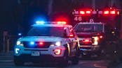 American Police Car and Emergency truck with Blue and red lights. US Paramedic Fire Rescue resuscita...