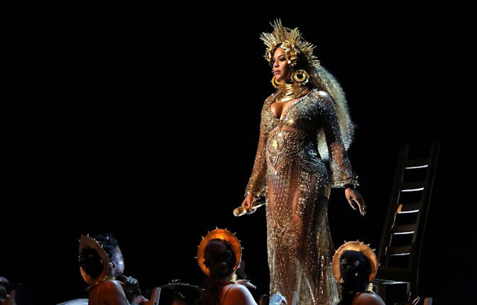 Beyonce performing at the 59th annual Grammy Awards in Los Angeles. Beyonce, who is pregnant with tw...