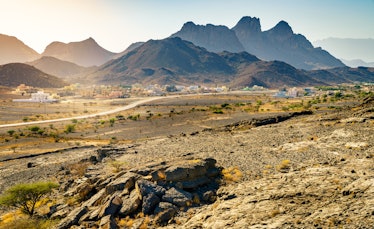 View of Hajar Mountains and a small village near Al Hoota cave in Oman