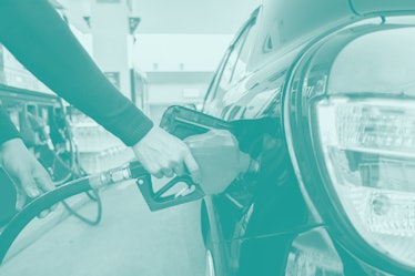 Refuel cars at the fuel pump. The driver hands, refuel and pump the car's gasoline with fuel at the ...