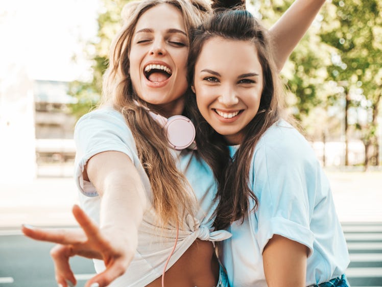 Two women wondering how to make clothes look new again talk about products that restore clothes.