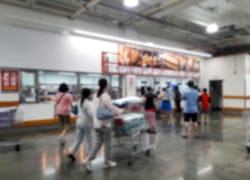 shoppers at costco store, is costco open on the fourth of july