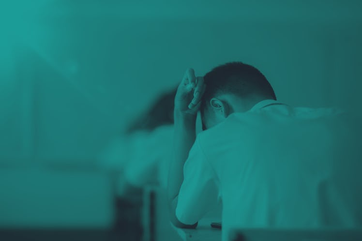 Exam or assessment of students concept, behind student in classroom sitting on chair, white uniform ...