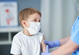 Portrait of adorable little boy being vaccinate at doctor's office.