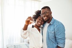 couple holding a key after moving in together