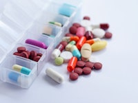 Pill box daily take a medicine, with colorful of pills, tablets, and capsules. Drugs use for treatme...