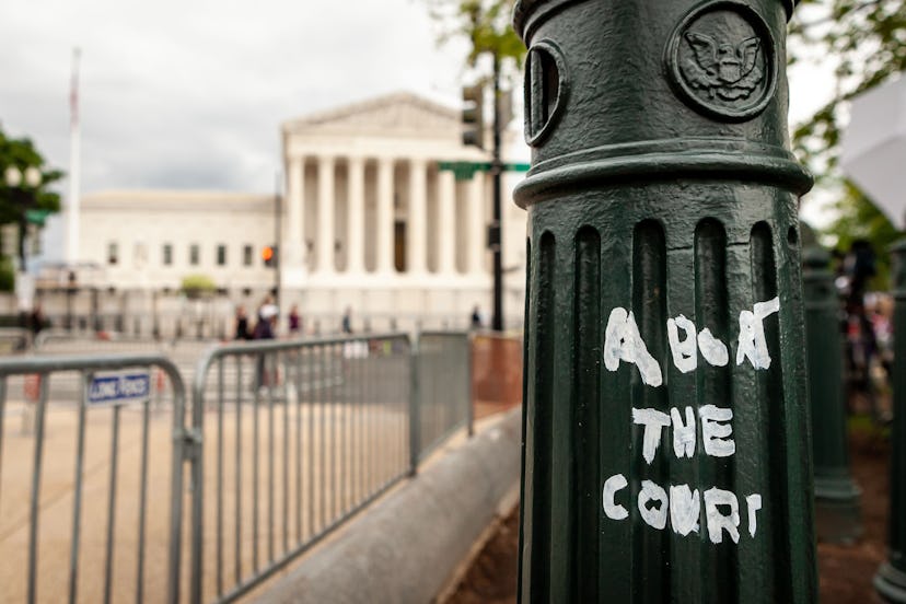 Graffiti on a decorative post on Capitol grounds reads &quot;abort the court,&quot; a reference to t...