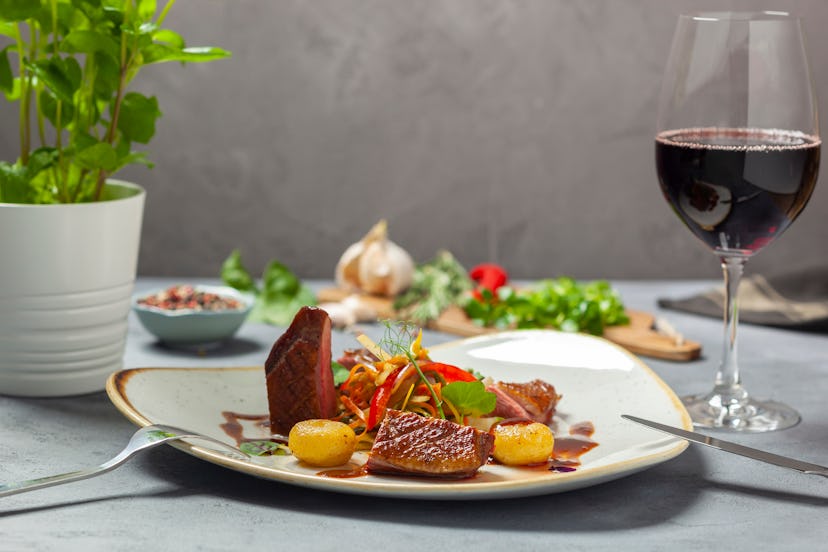 Duck breast sous vide smoked, crispy vegetable salad with mango dressing, Silesian noodles, orange d...