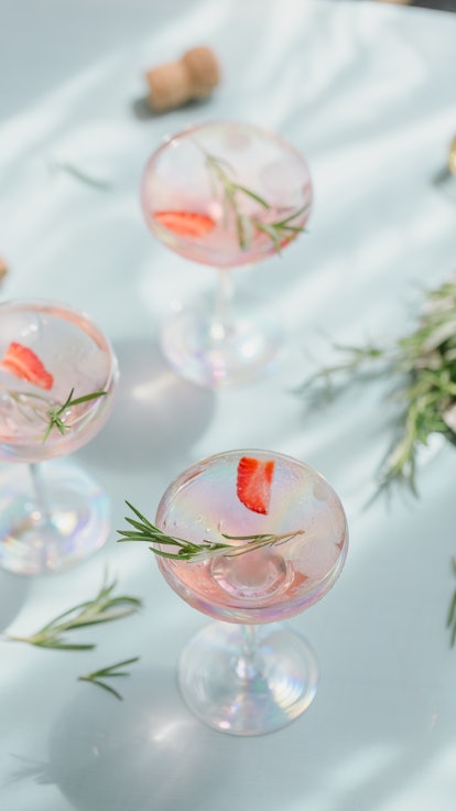Summer drink with white sparkling wine. Homemade refreshing fruit cocktail or punch with champagne, ...