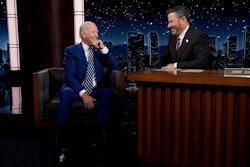 President Joe Biden speaks with host Jimmy Kimmel during a commercial break during the taping of Jim...